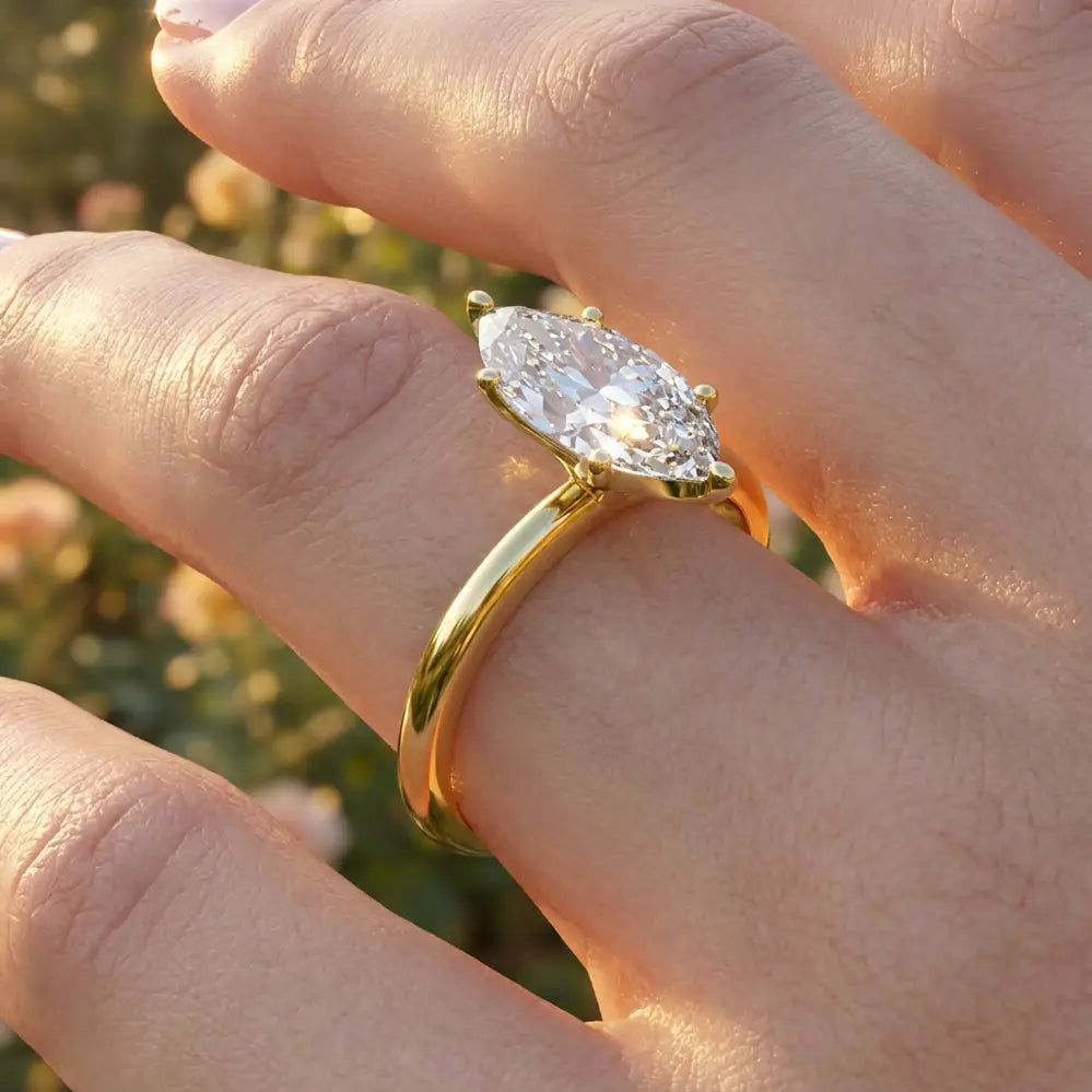 Marquise diamond six-prong solitaire engagement ring shown on a classic polished band.