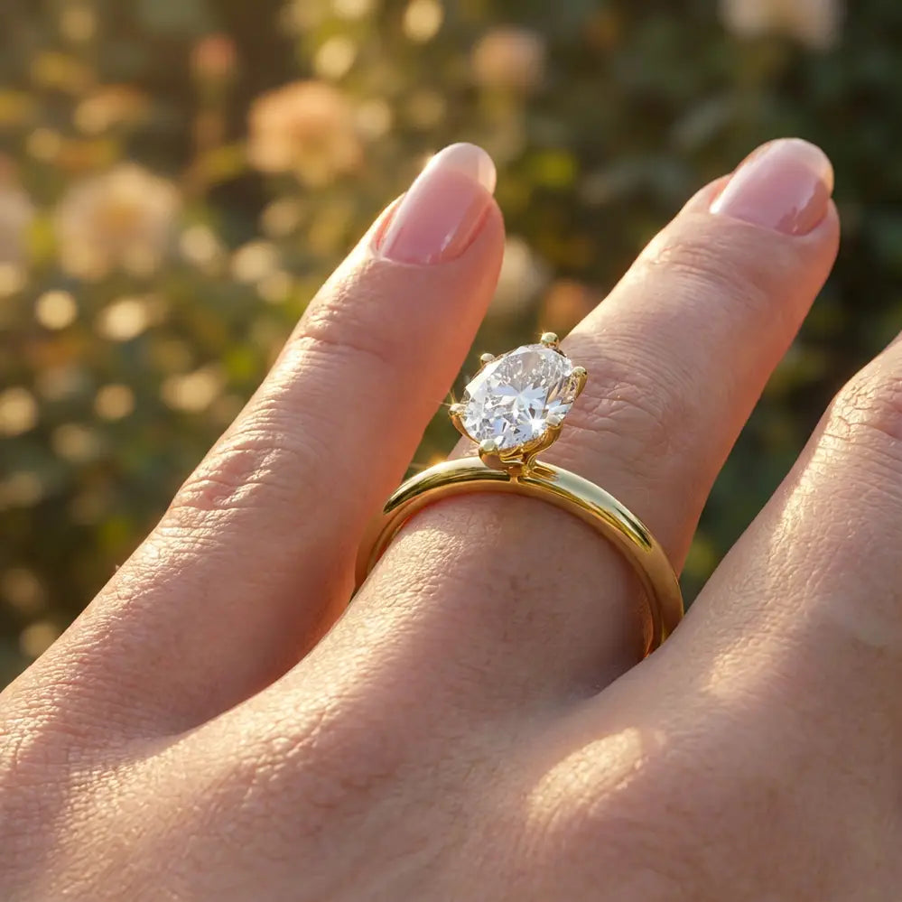 Marquise diamond six-prong solitaire engagement ring shown on a classic polished band.