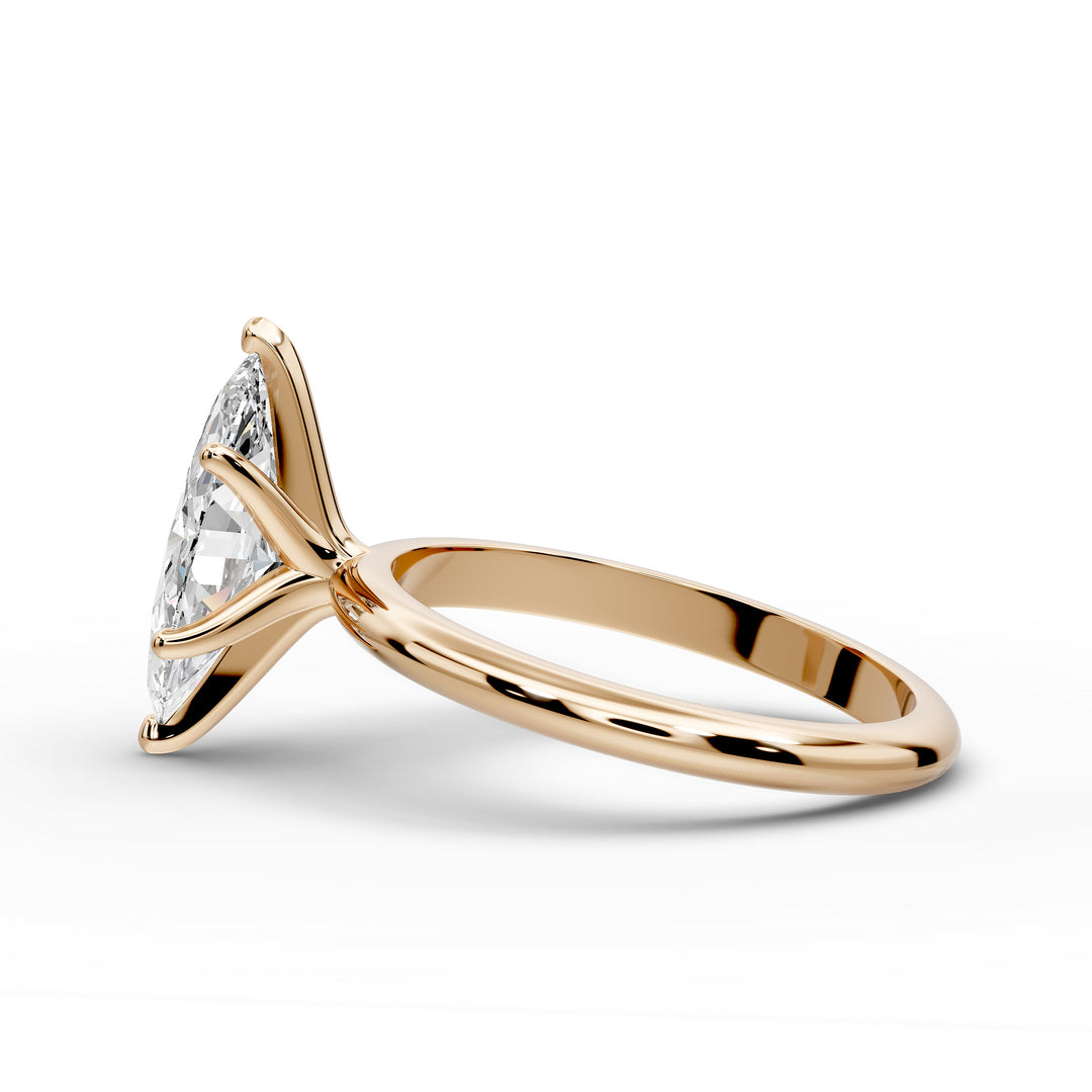 Marquise diamond six-prong solitaire engagement ring shown on a classic polished band.