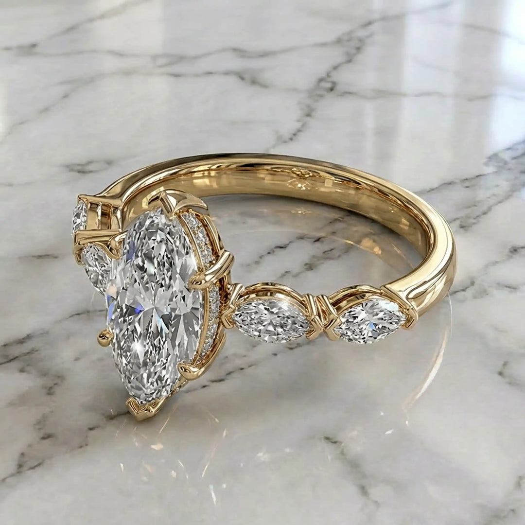 2 carat marquise lab diamond engagement ring with hidden halo and marquise accent band on marbel.

