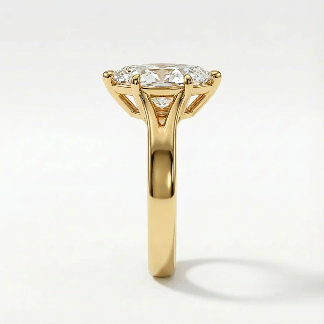 Marquise-cut lab-grown diamond split shank solitaire ring displayed on satin.
