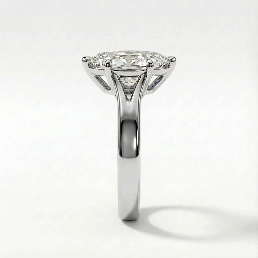 Marquise-cut lab-grown diamond split shank solitaire ring displayed on satin.
