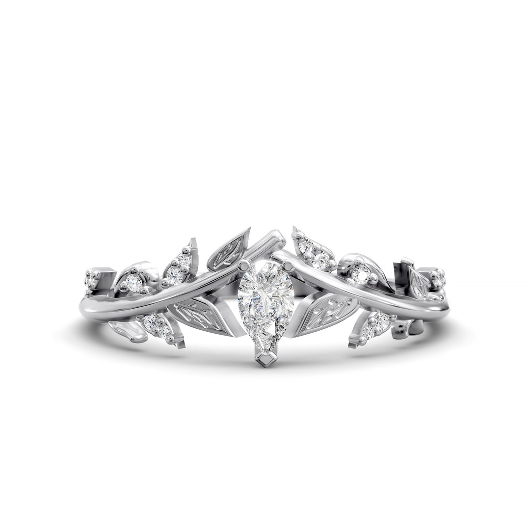 Leaf and vine wedding band with pear-shaped center stone and small accent stones