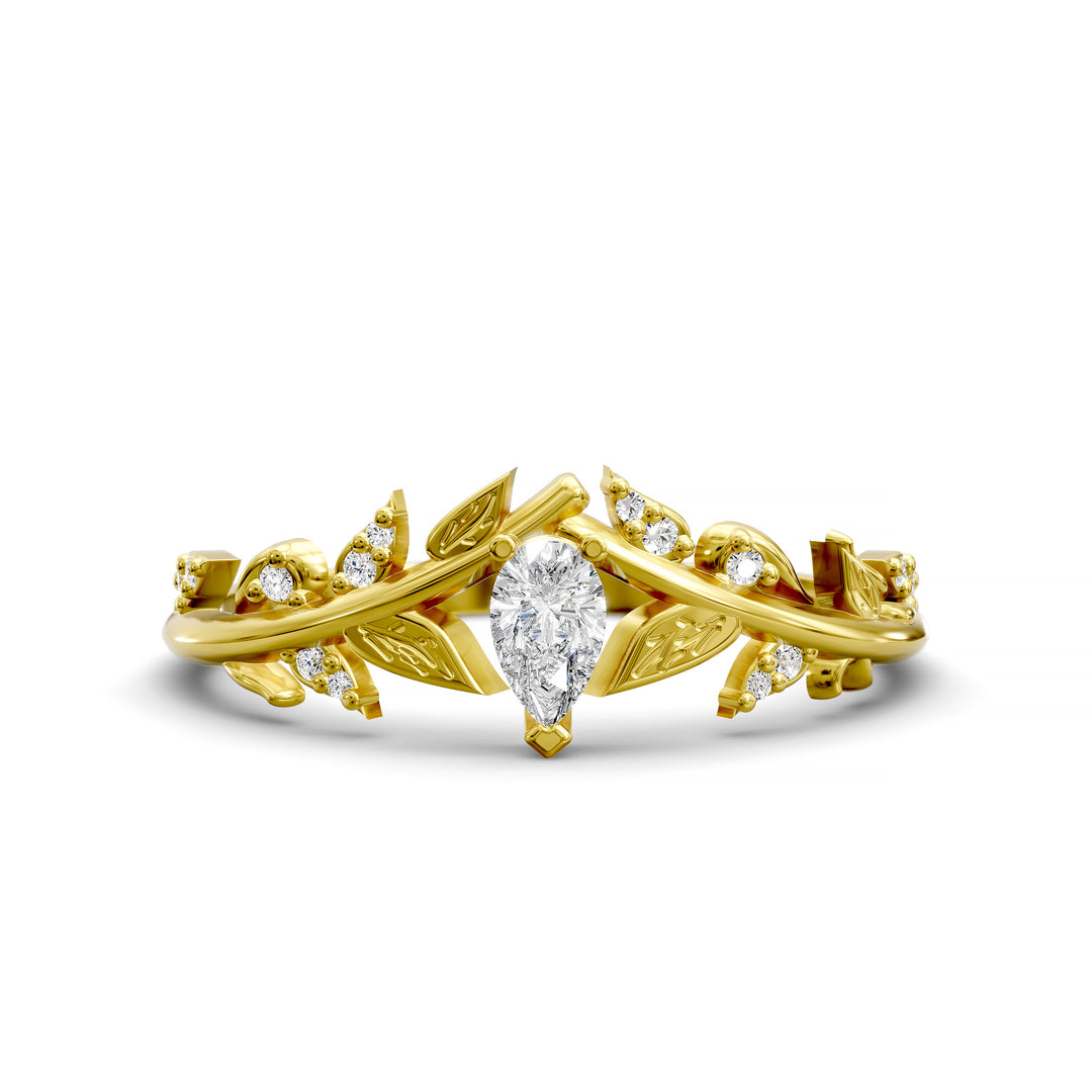 Leaf and vine wedding band with pear-shaped center stone and small accent stones