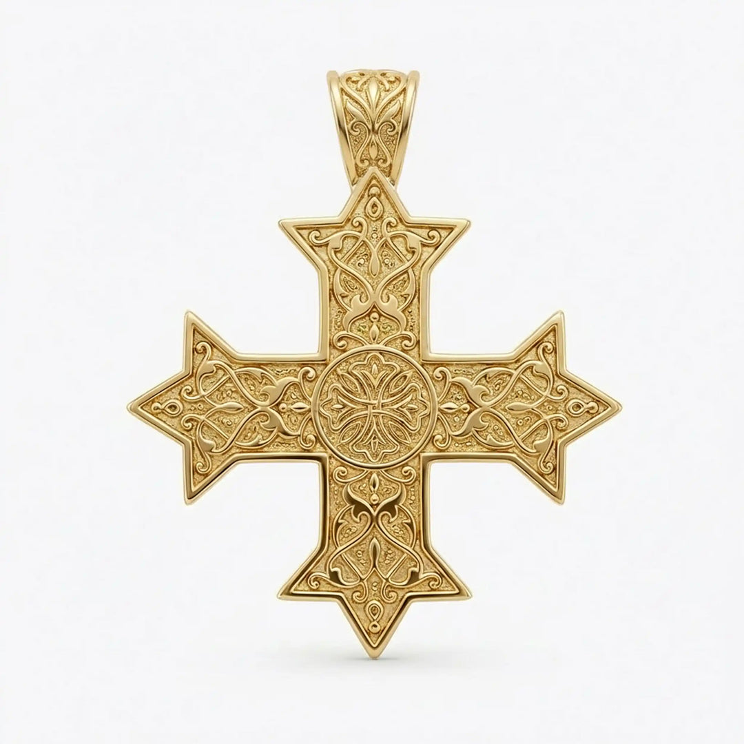 Ornate Coptic cross pendant with intricate filigree pattern displayed on neutral background.
