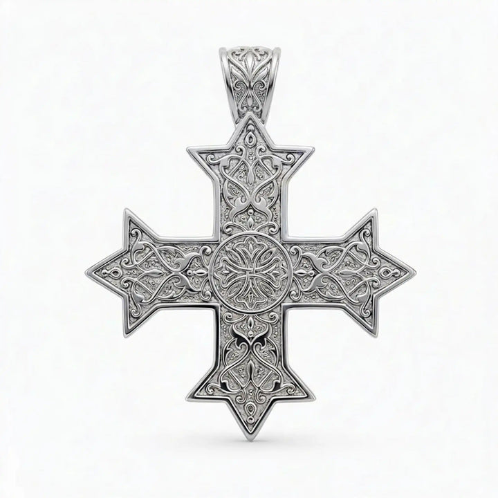 Ornate Coptic cross pendant with intricate filigree pattern displayed on neutral background.
