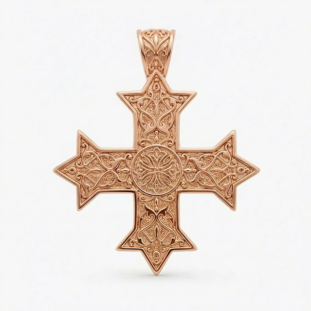 Ornate Coptic cross pendant with intricate filigree pattern displayed on neutral background.
