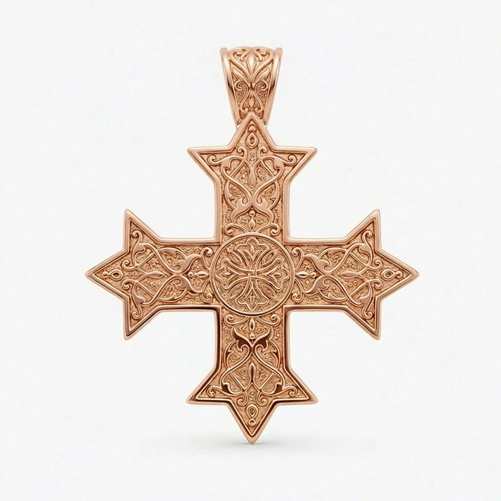 Ornate Coptic cross pendant with intricate filigree pattern displayed on neutral background.
