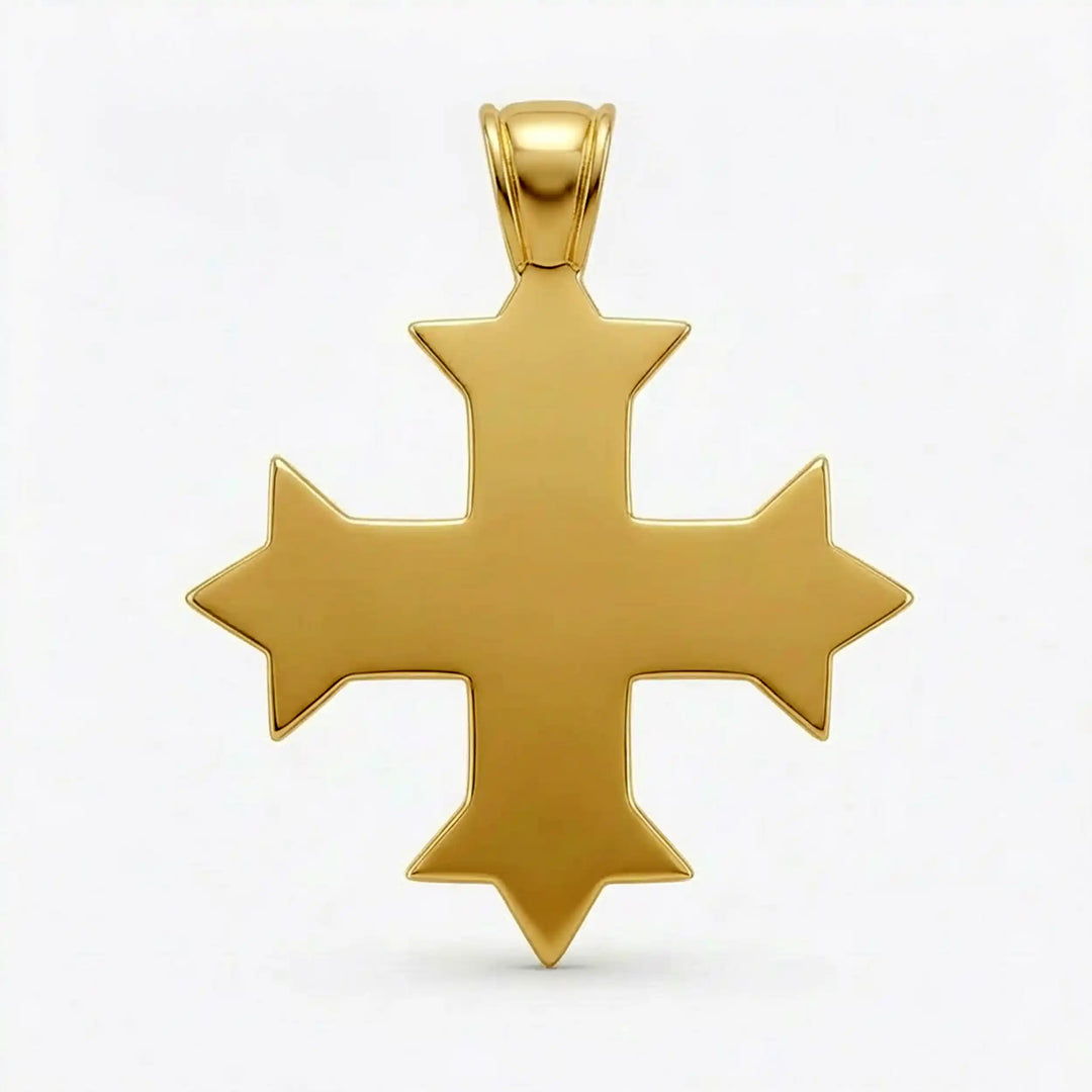 Ornate Coptic cross pendant with intricate filigree pattern displayed on neutral background.

