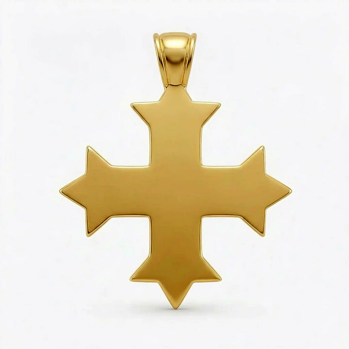 Ornate Coptic cross pendant with intricate filigree pattern displayed on neutral background.
