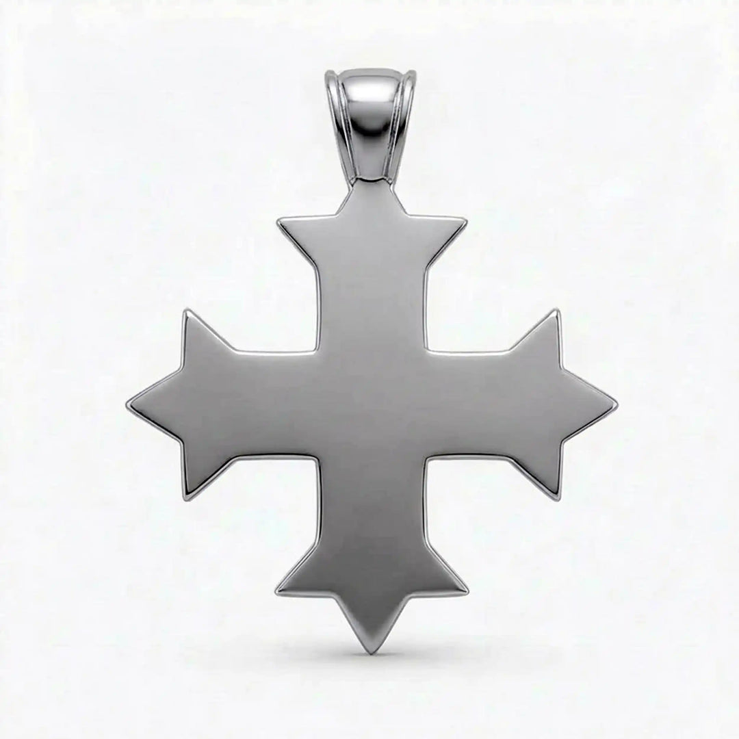 Ornate Coptic cross pendant with intricate filigree pattern displayed on neutral background.
