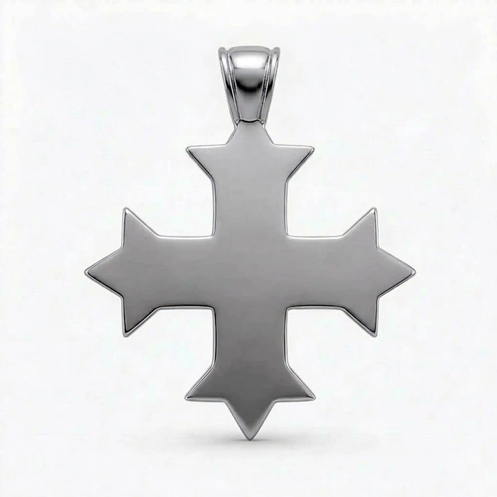Ornate Coptic cross pendant with intricate filigree pattern displayed on neutral background.
