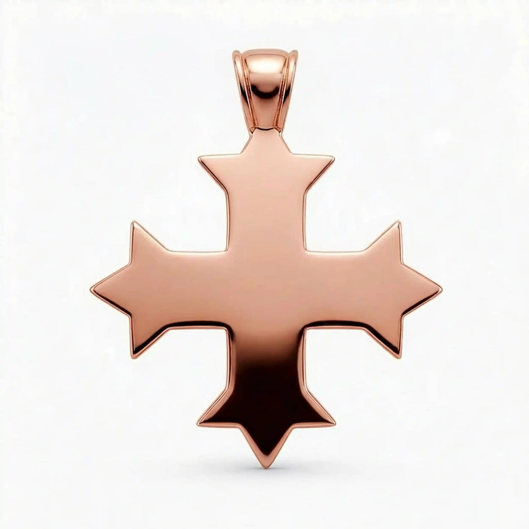 Ornate Coptic cross pendant with intricate filigree pattern displayed on neutral background.
