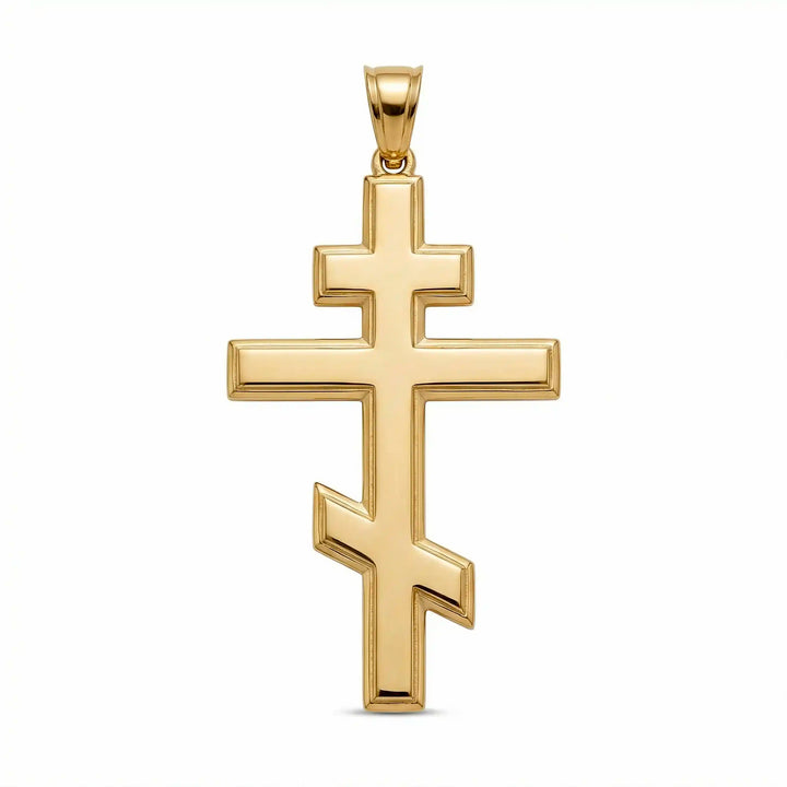 Orthodox three-bar Christian cross pendant displayed on white background.