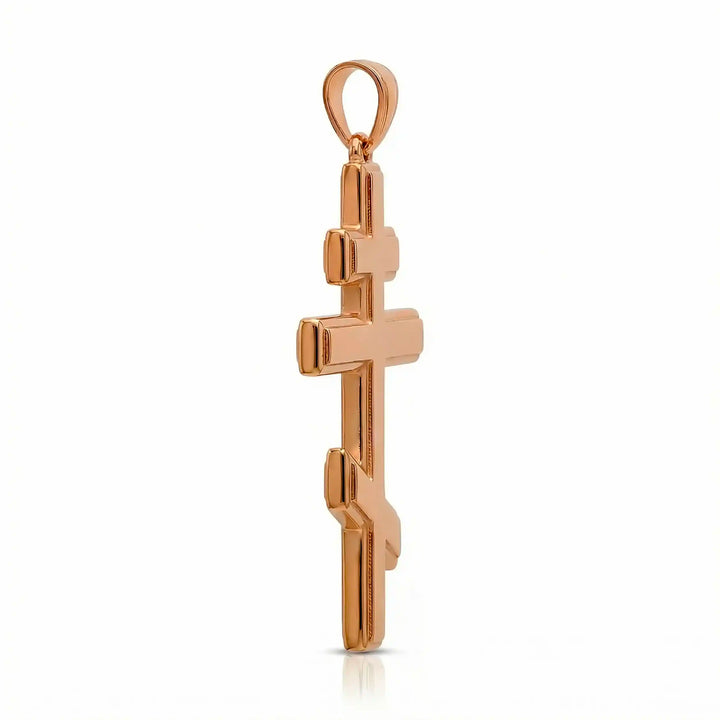 Orthodox three-bar Christian cross pendant displayed on white background.