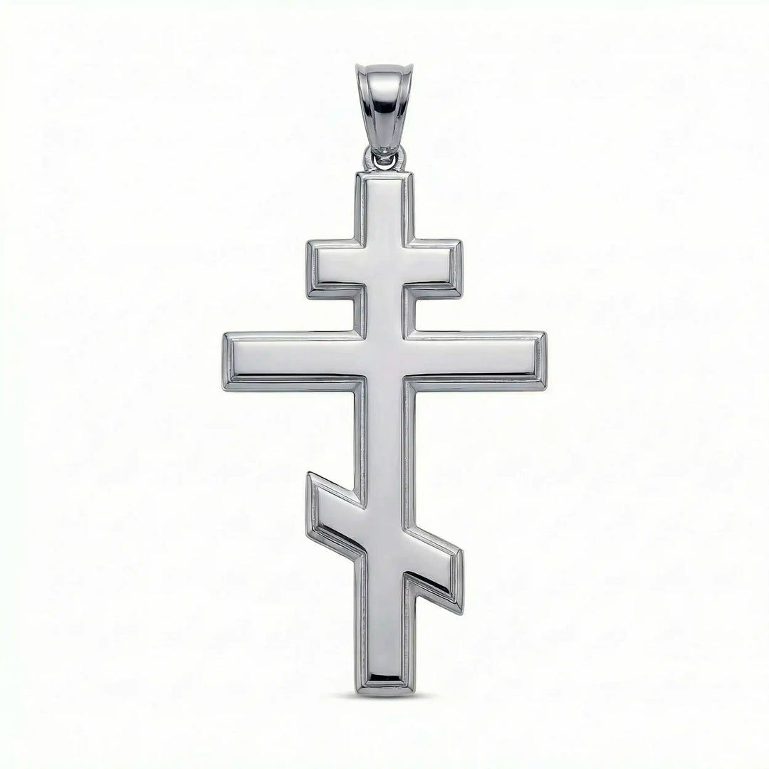 Orthodox three-bar Christian cross pendant displayed on white background.