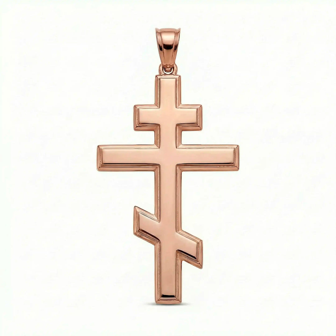 Orthodox three-bar Christian cross pendant displayed on white background.