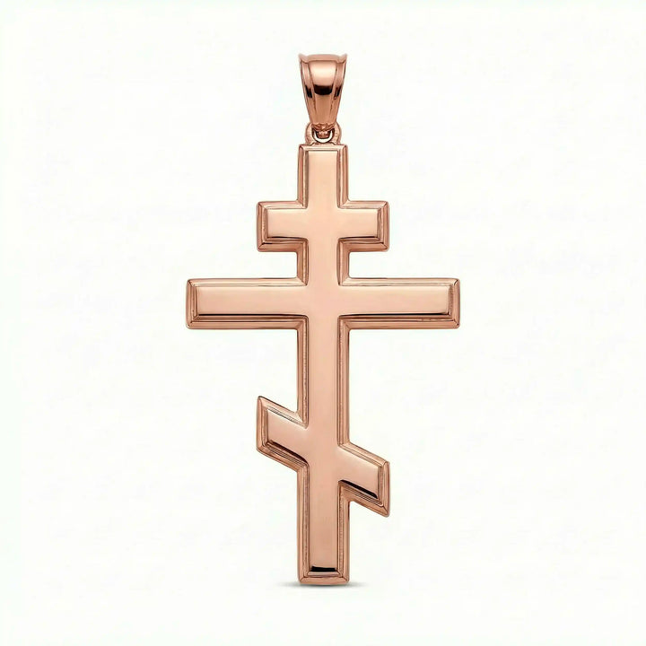 Orthodox three-bar Christian cross pendant displayed on white background.