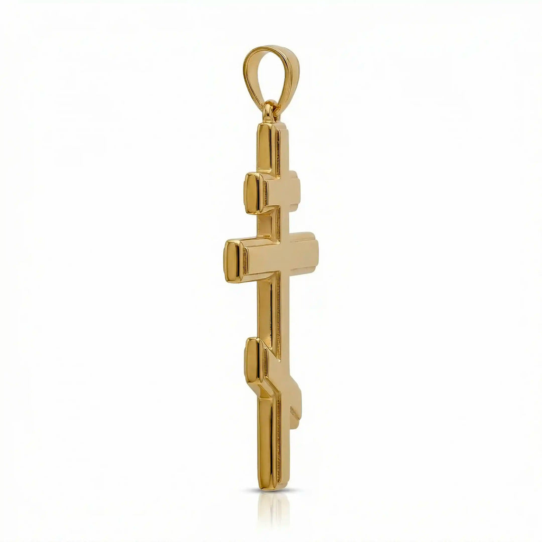 Orthodox three-bar Christian cross pendant displayed on white background.