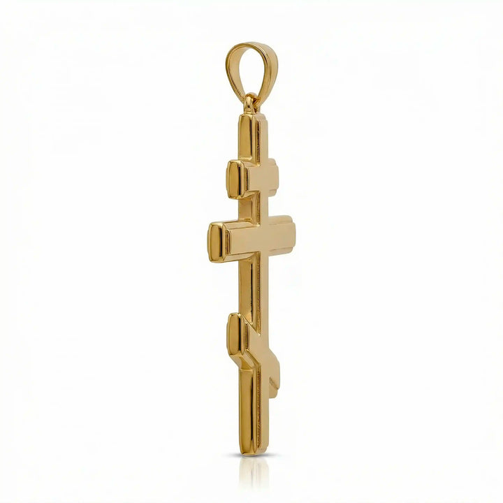 Orthodox three-bar Christian cross pendant displayed on white background.