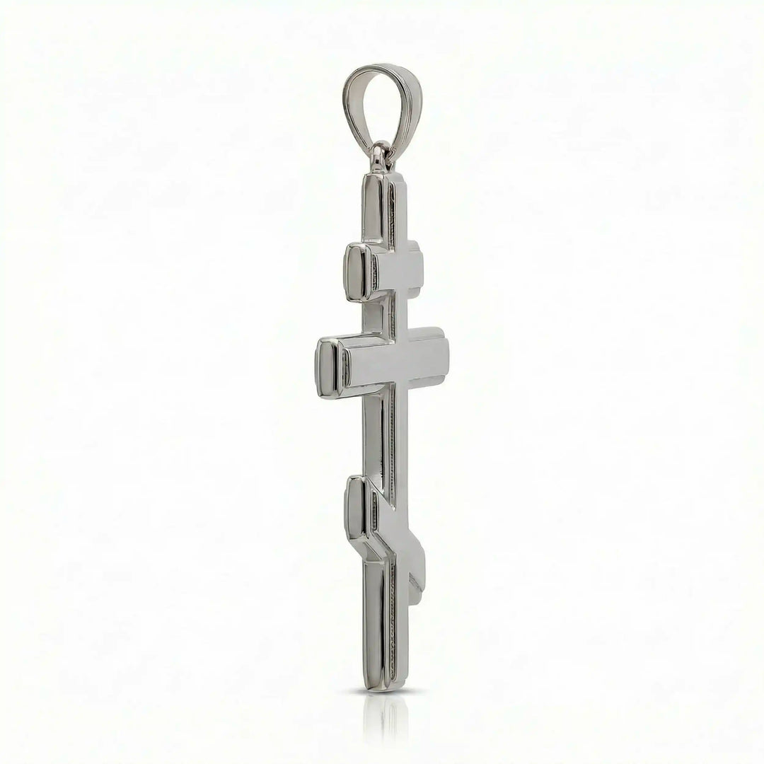 Orthodox three-bar Christian cross pendant displayed on white background.