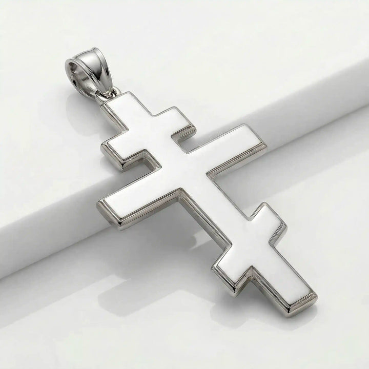 Orthodox three-bar Christian cross pendant displayed on white background.