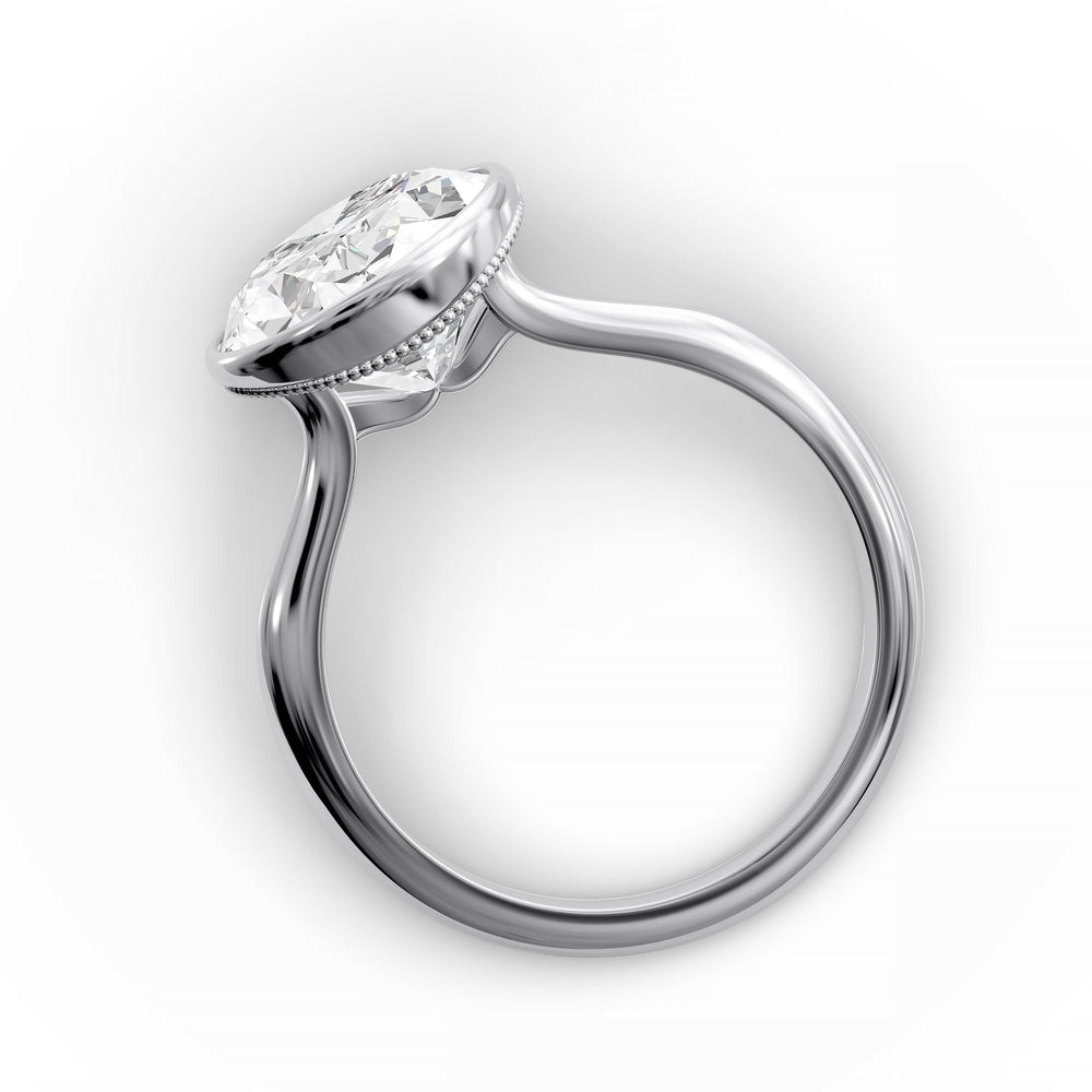 Oval bezel vintage diamond engagement ring with polished band in studio view.