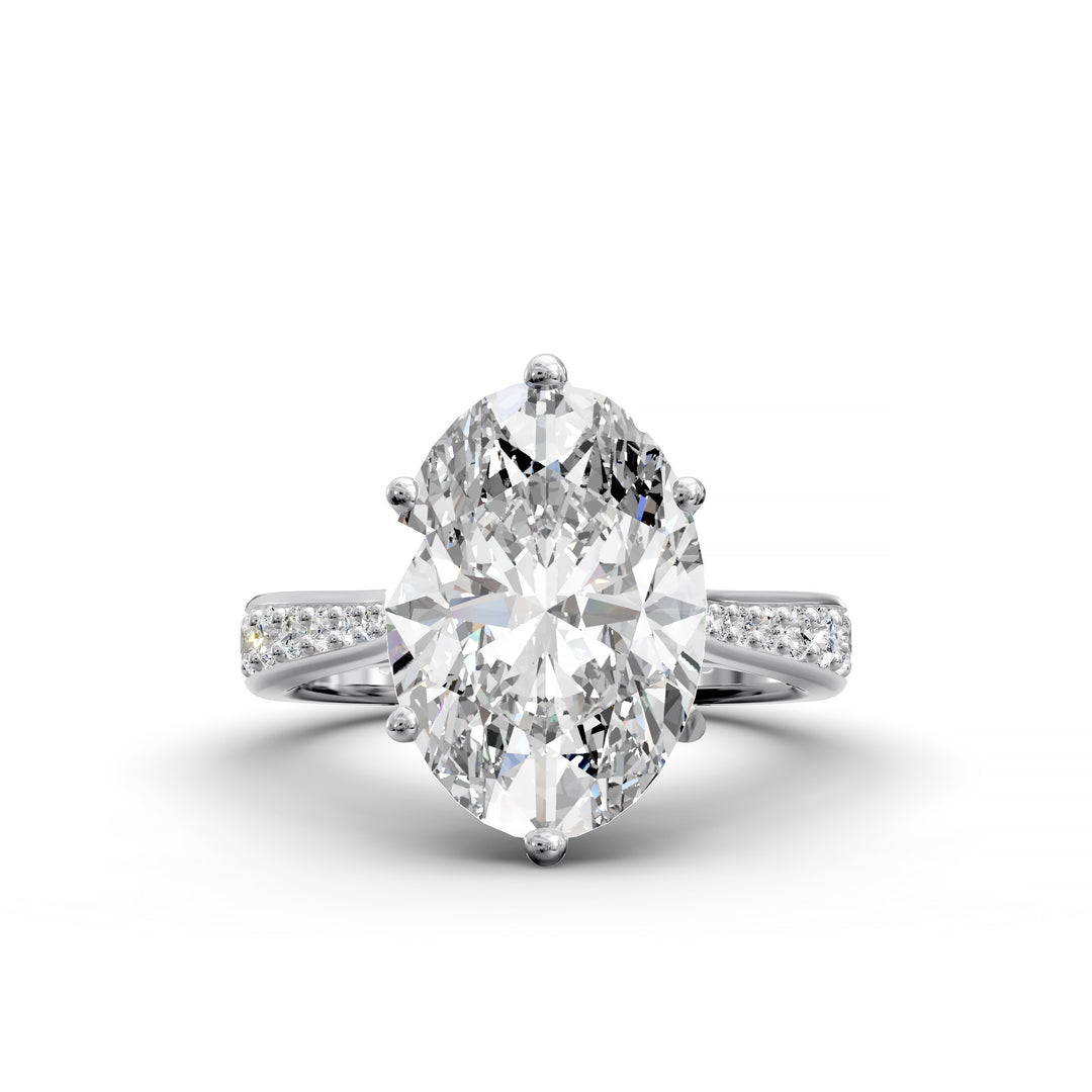 Oval diamond cathedral engagement ring with channel-set band shown in studio view.