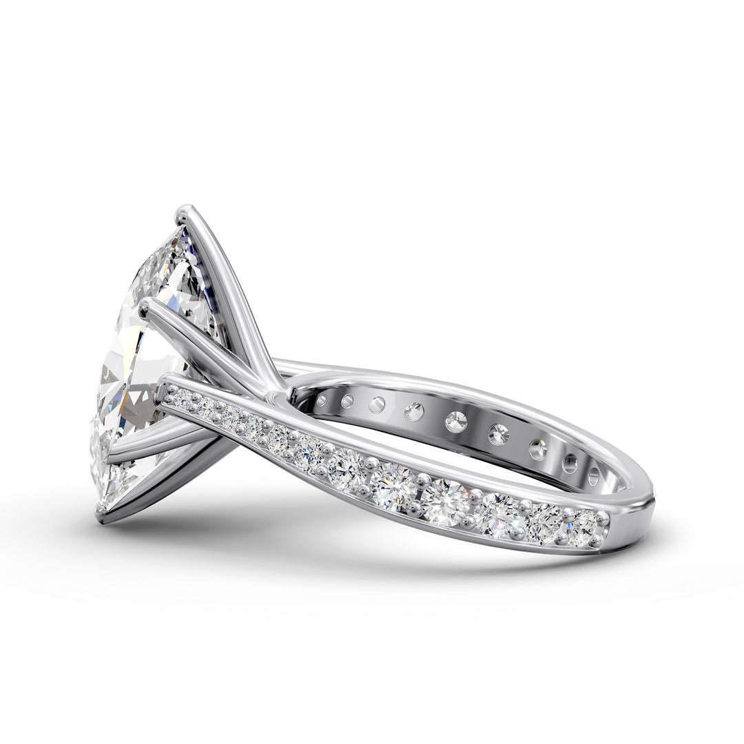 Oval diamond cathedral engagement ring with channel-set band shown in studio view.