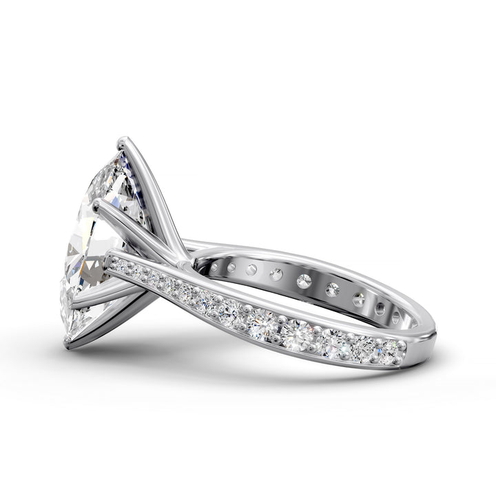 Oval diamond cathedral engagement ring with channel-set band shown in studio view.