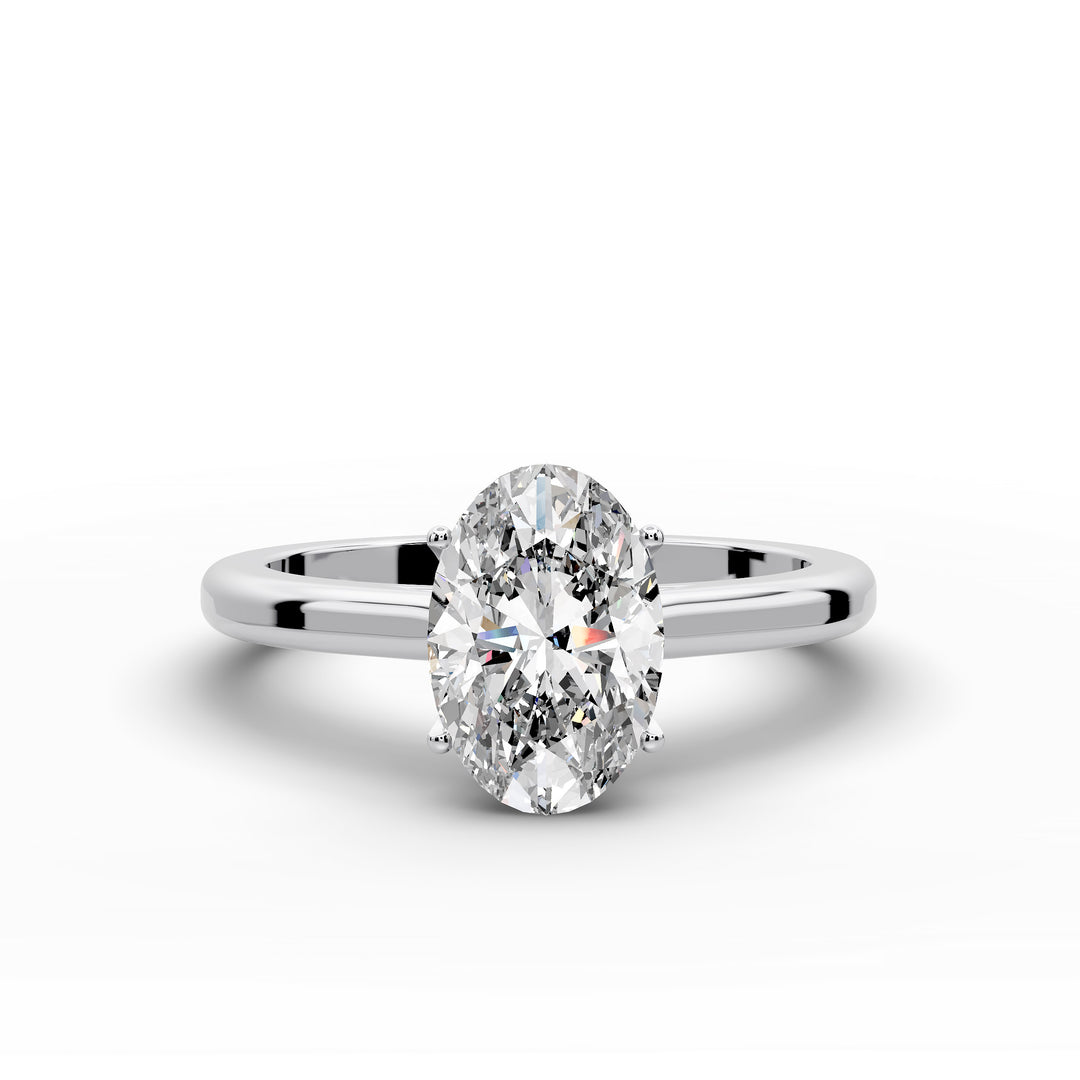 Oval diamond cathedral solitaire engagement ring shown on a classic polished band
