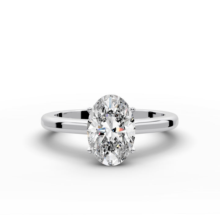 Oval diamond cathedral solitaire engagement ring shown on a classic polished band
