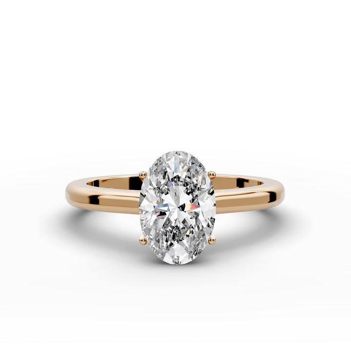 Oval diamond cathedral solitaire engagement ring shown on a classic polished band

