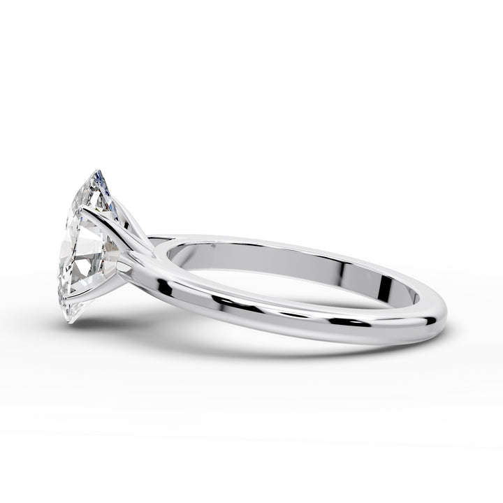 Oval diamond cathedral solitaire engagement ring shown on a classic polished band
