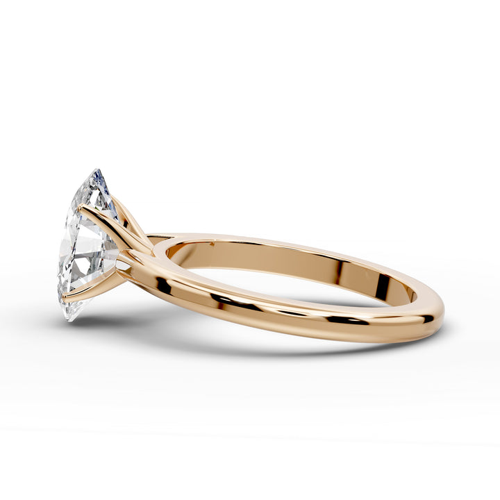 Oval diamond cathedral solitaire engagement ring shown on a classic polished band
