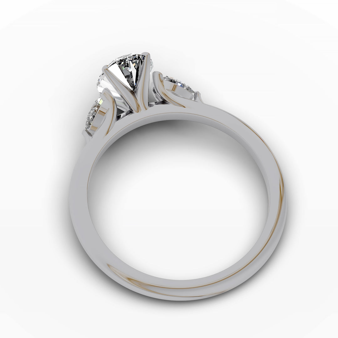 Oval diamond engagement ring with pear-shaped side stones front view.
