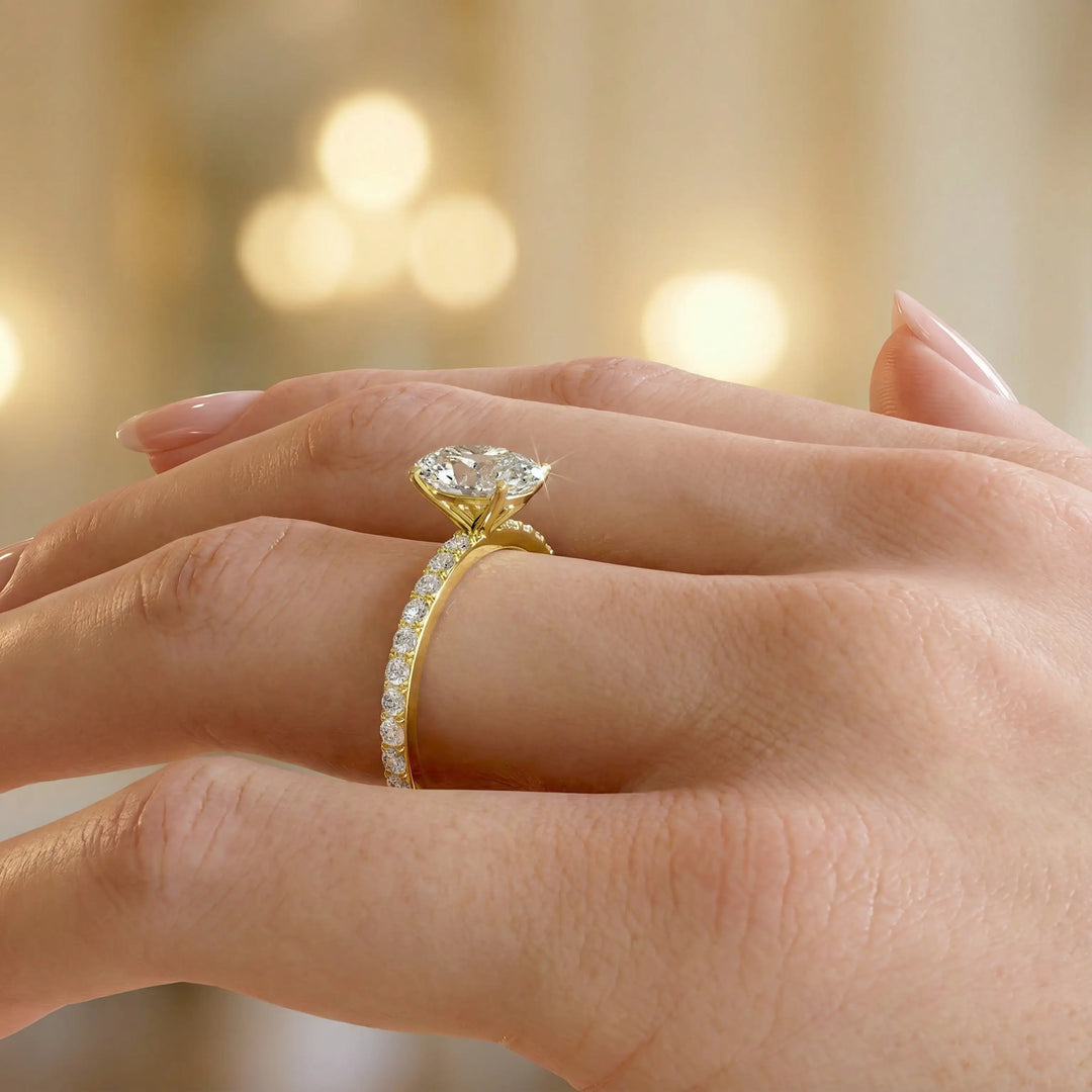 Oval diamond engagement ring with scintillating single row diamond band.