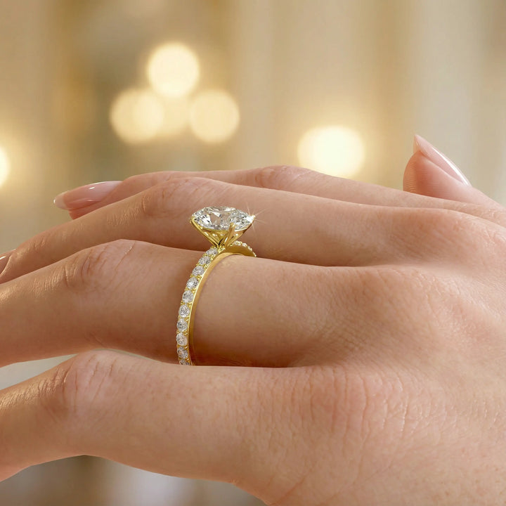 Oval diamond engagement ring with scintillating single row diamond band.