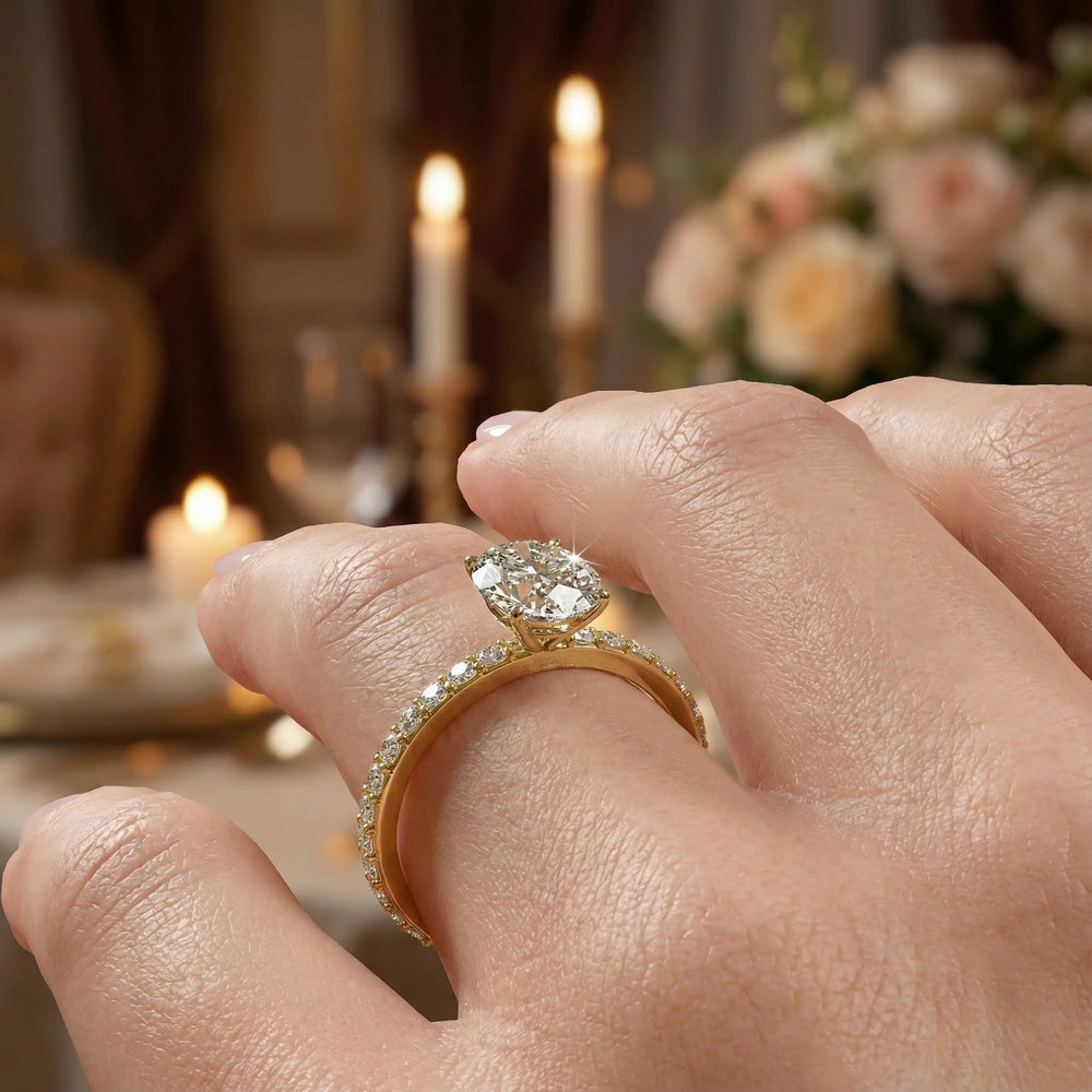 Oval diamond engagement ring with scintillating single row diamond band.