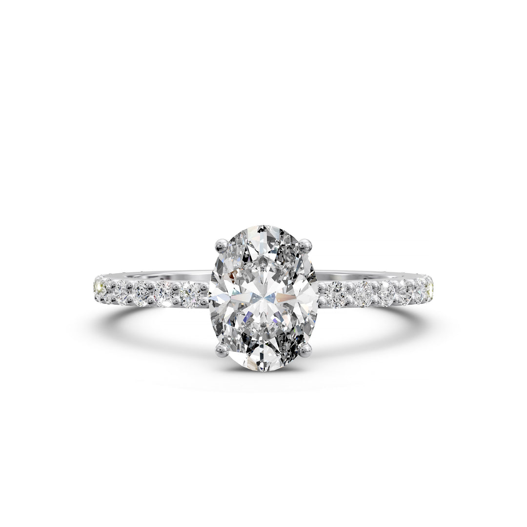Oval diamond engagement ring with scintillating single row diamond band.