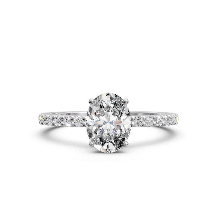 Oval diamond engagement ring with scintillating single row diamond band.