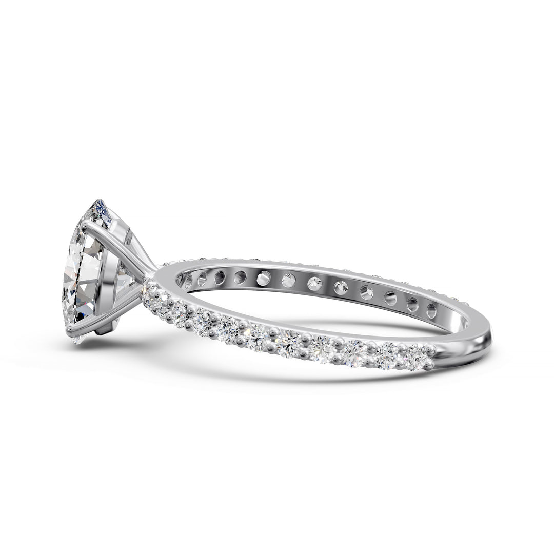 Oval diamond engagement ring with scintillating single row diamond band.