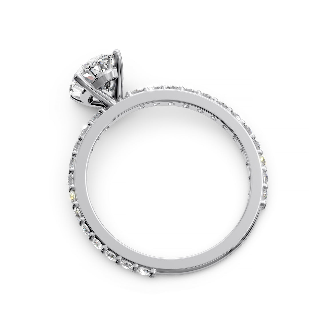 Oval diamond engagement ring with scintillating single row diamond band.