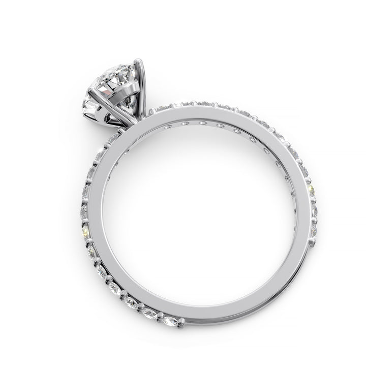 Oval diamond engagement ring with scintillating single row diamond band.