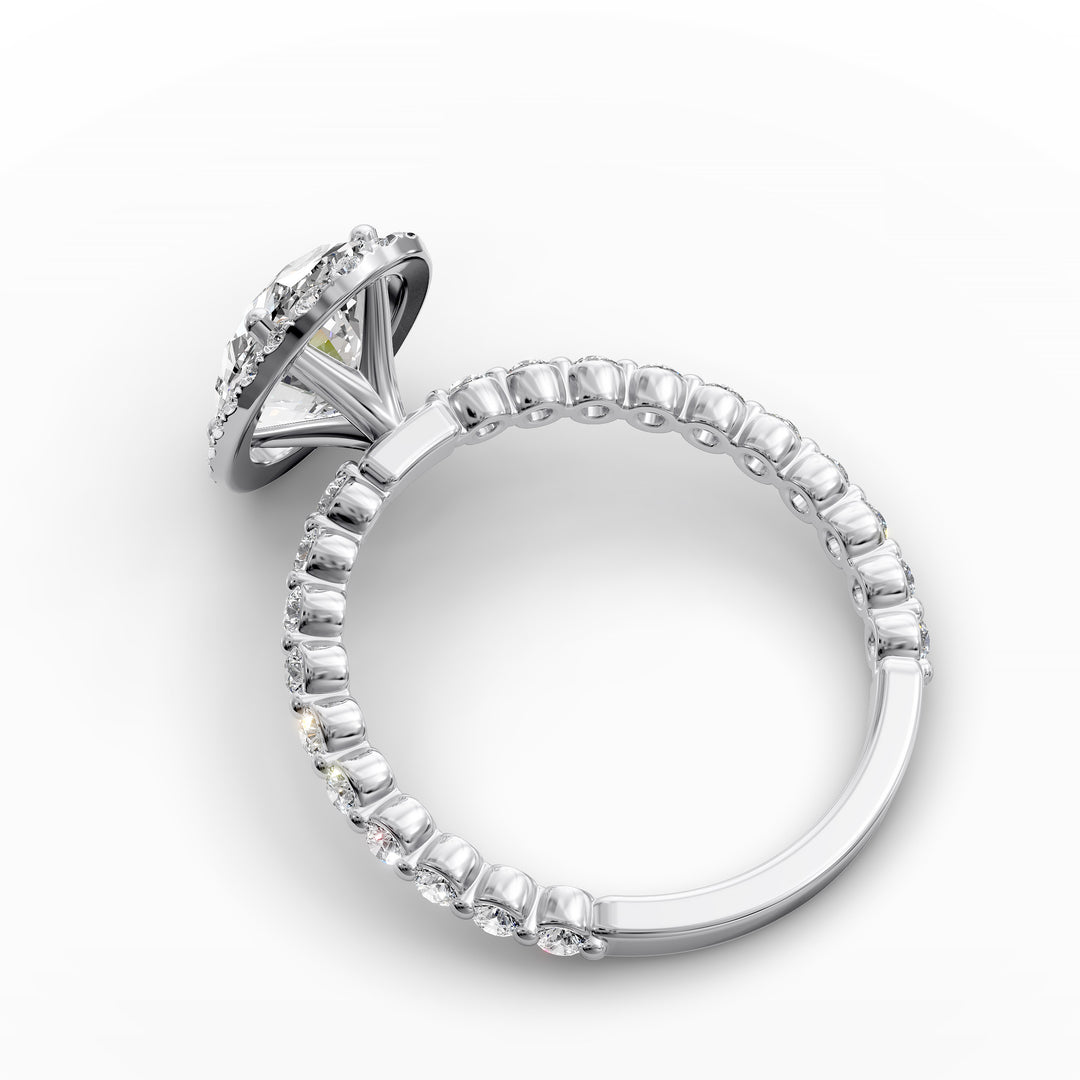Oval diamond halo engagement ring with floating shared-prong band shown in display view.