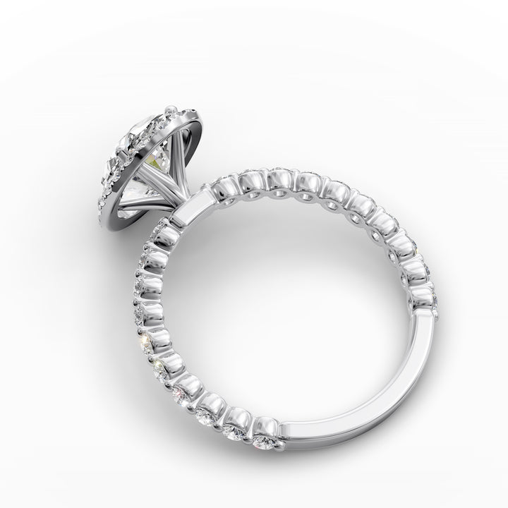 Oval diamond halo engagement ring with floating shared-prong band shown in display view.