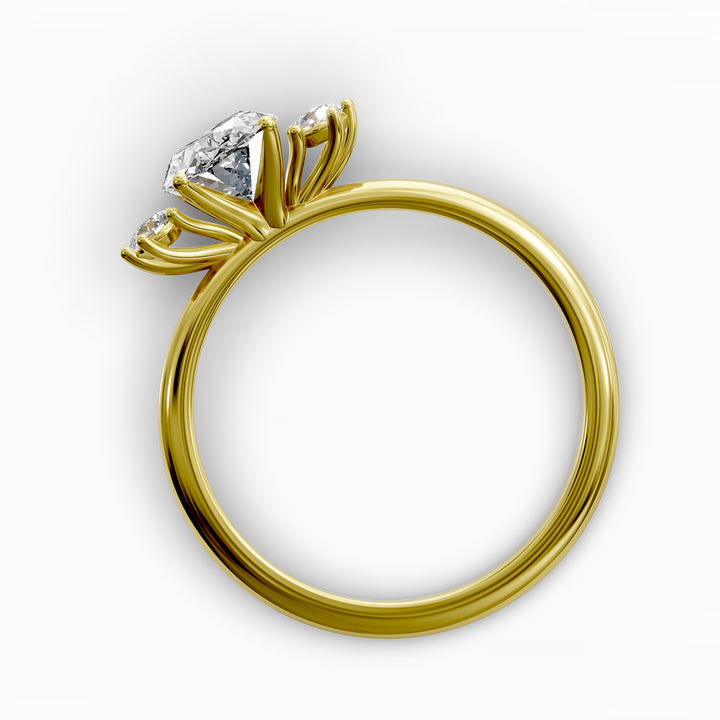 Oval diamond three-stone engagement ring with round side stones shown in display view.