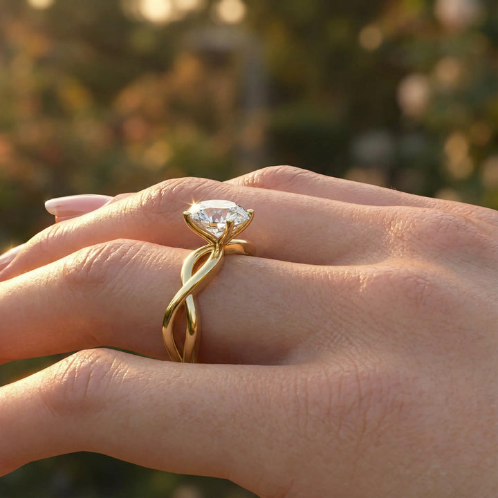 Oval diamond engagement ring with sculpted twisted band design.