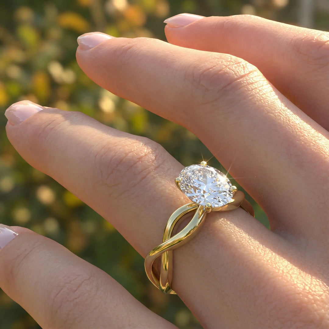 Oval diamond engagement ring with sculpted twisted band design.