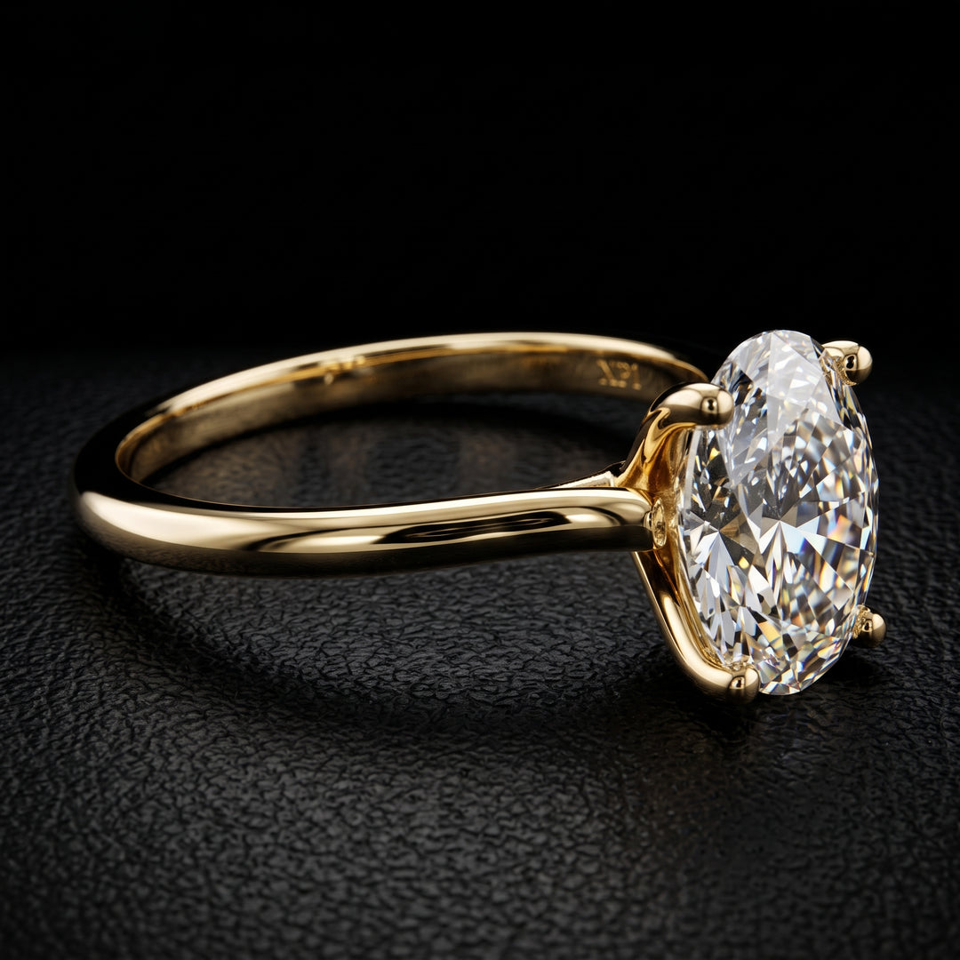 1.37 carat oval lab-grown diamond solitaire engagement ring displayed on a black jewelry background.